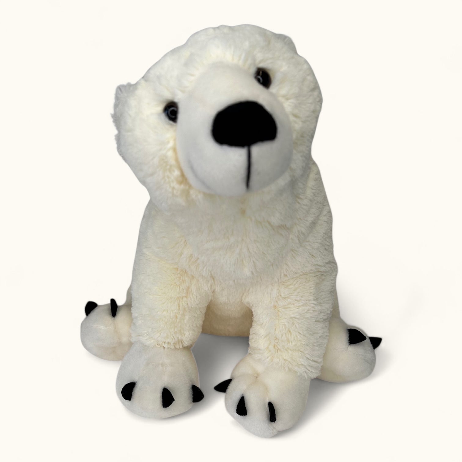 Plush polar bear toy on a white background