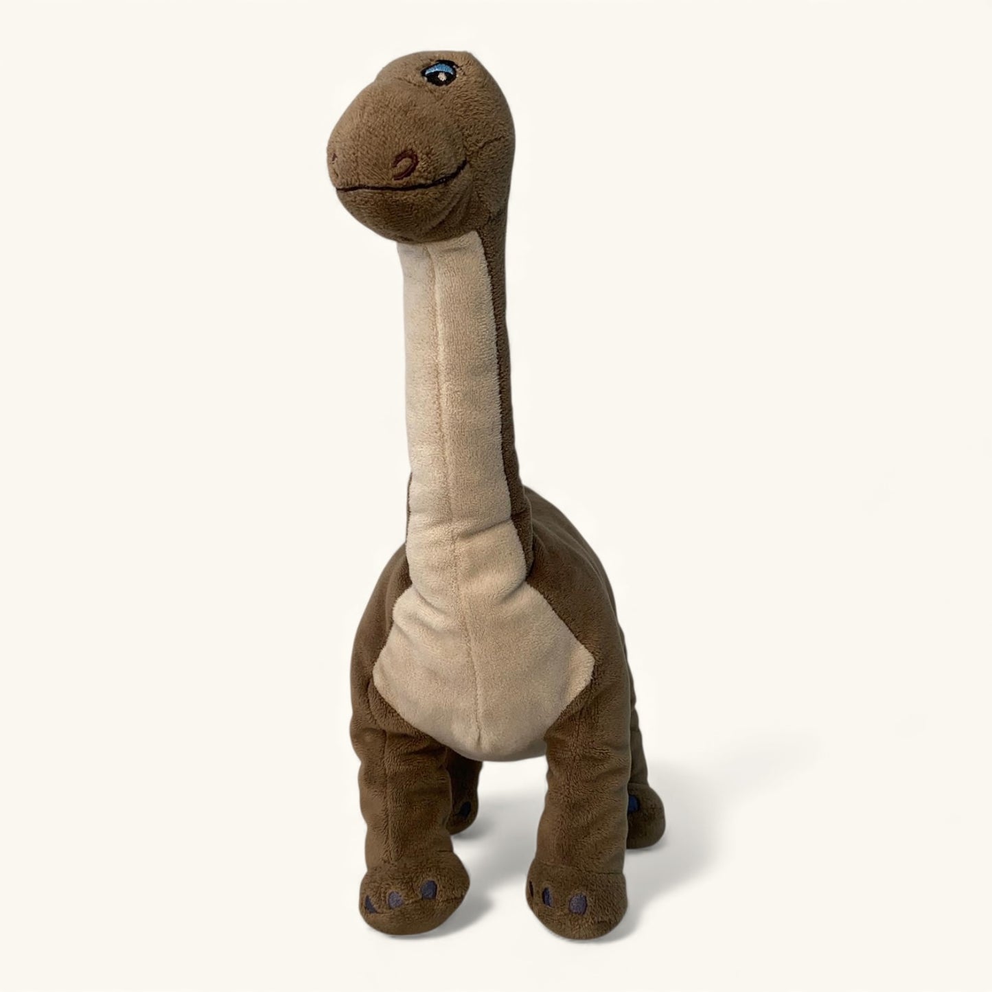 Plush dinosaur toy on a white background