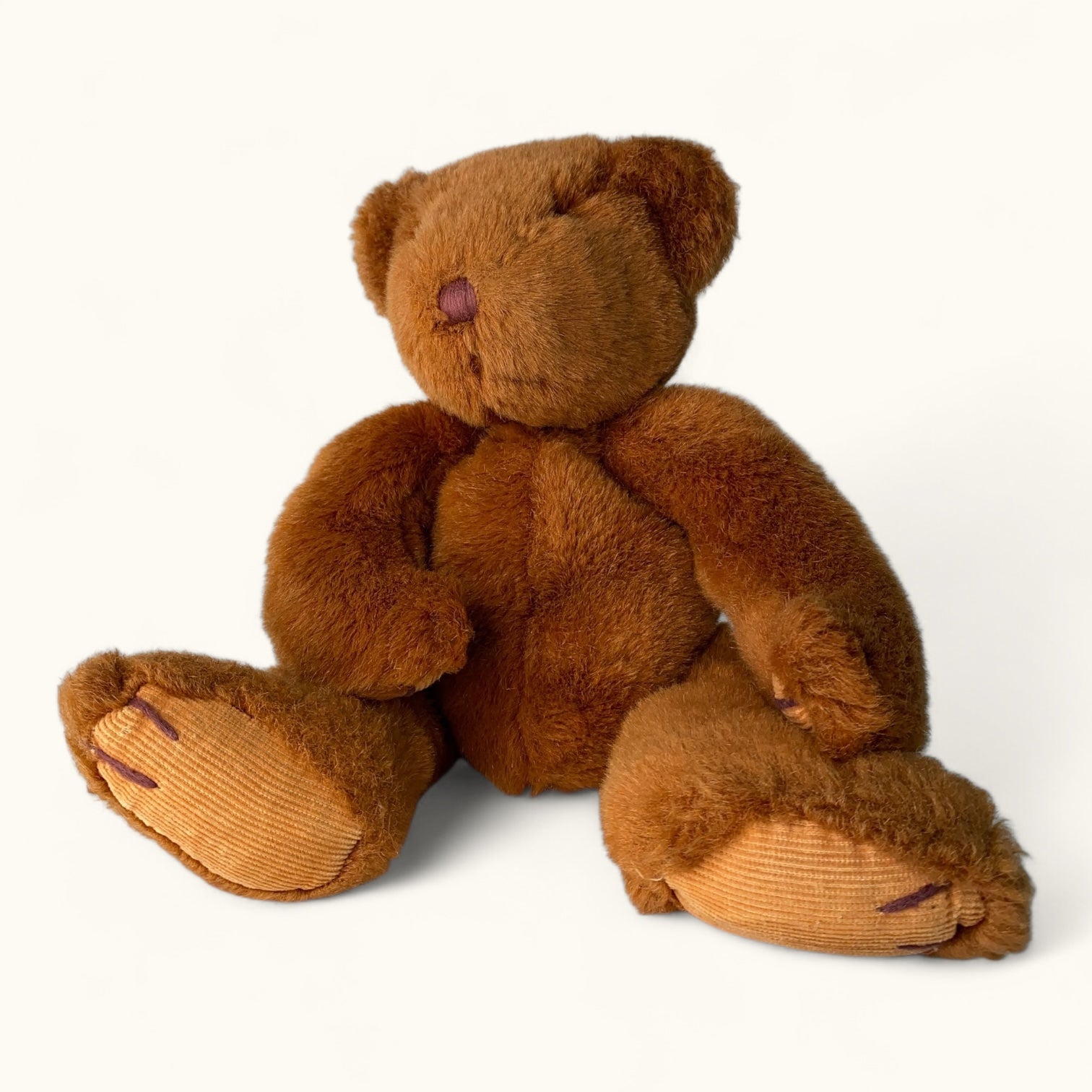 Brown teddy bear on a white background