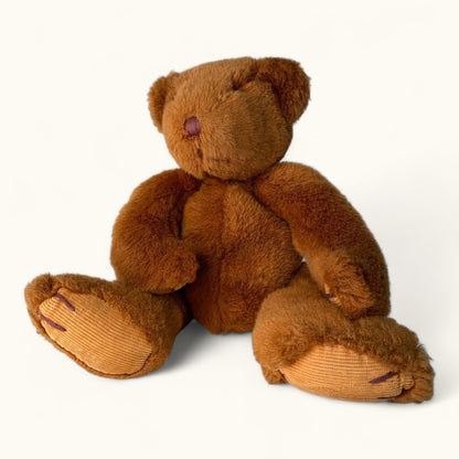Brown teddy bear on a white background