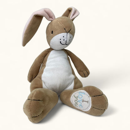 Brown plush bunny toy with a white belly on a light gray background