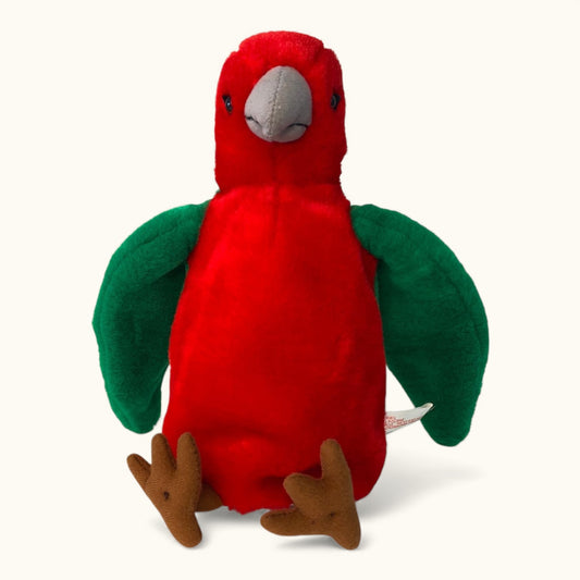 Red plush parrot toy with green wings on a white background
