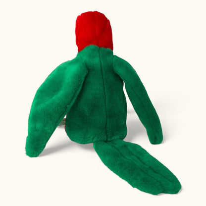 Green plush toy with a red hat on a white background