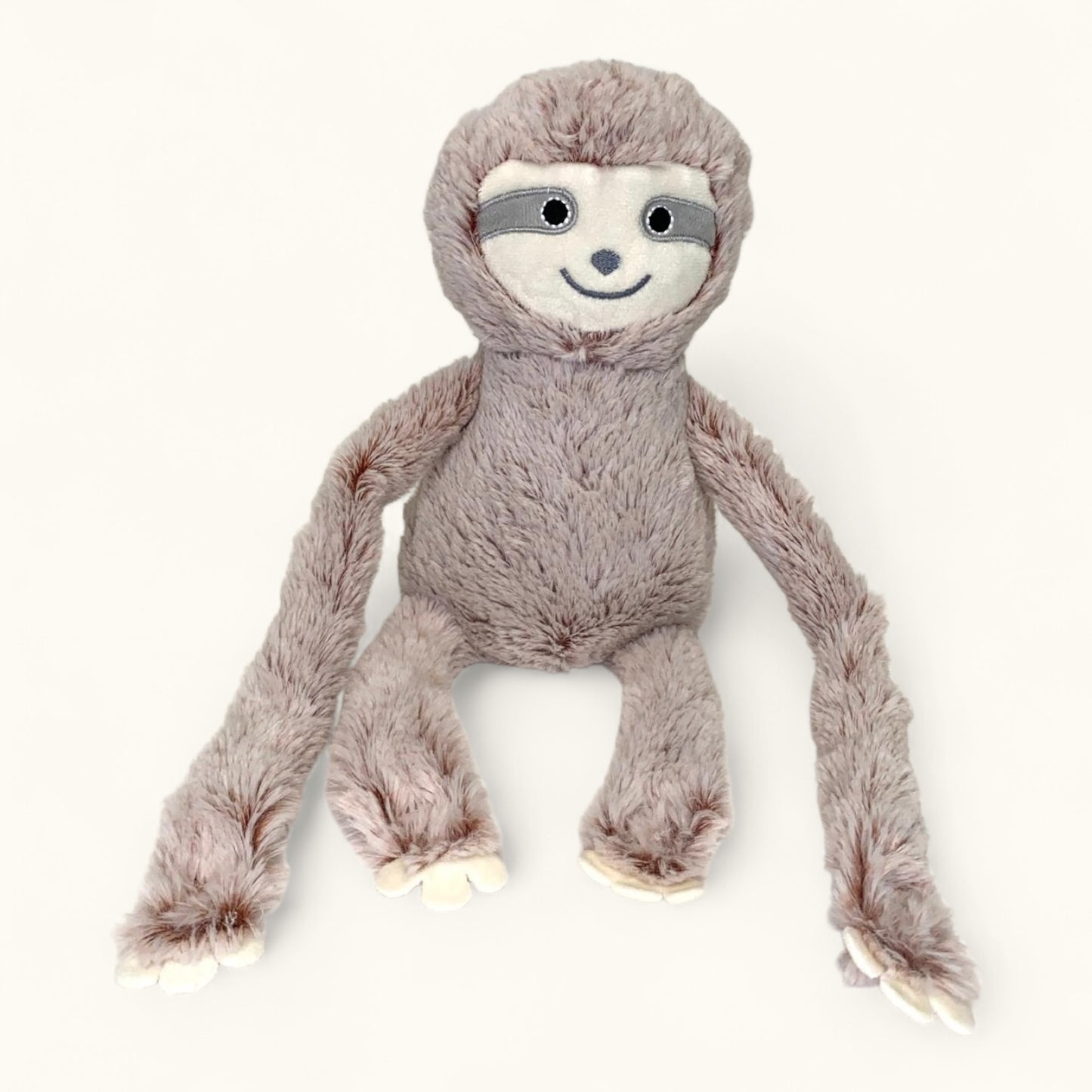 Plush toy sloth on a white background