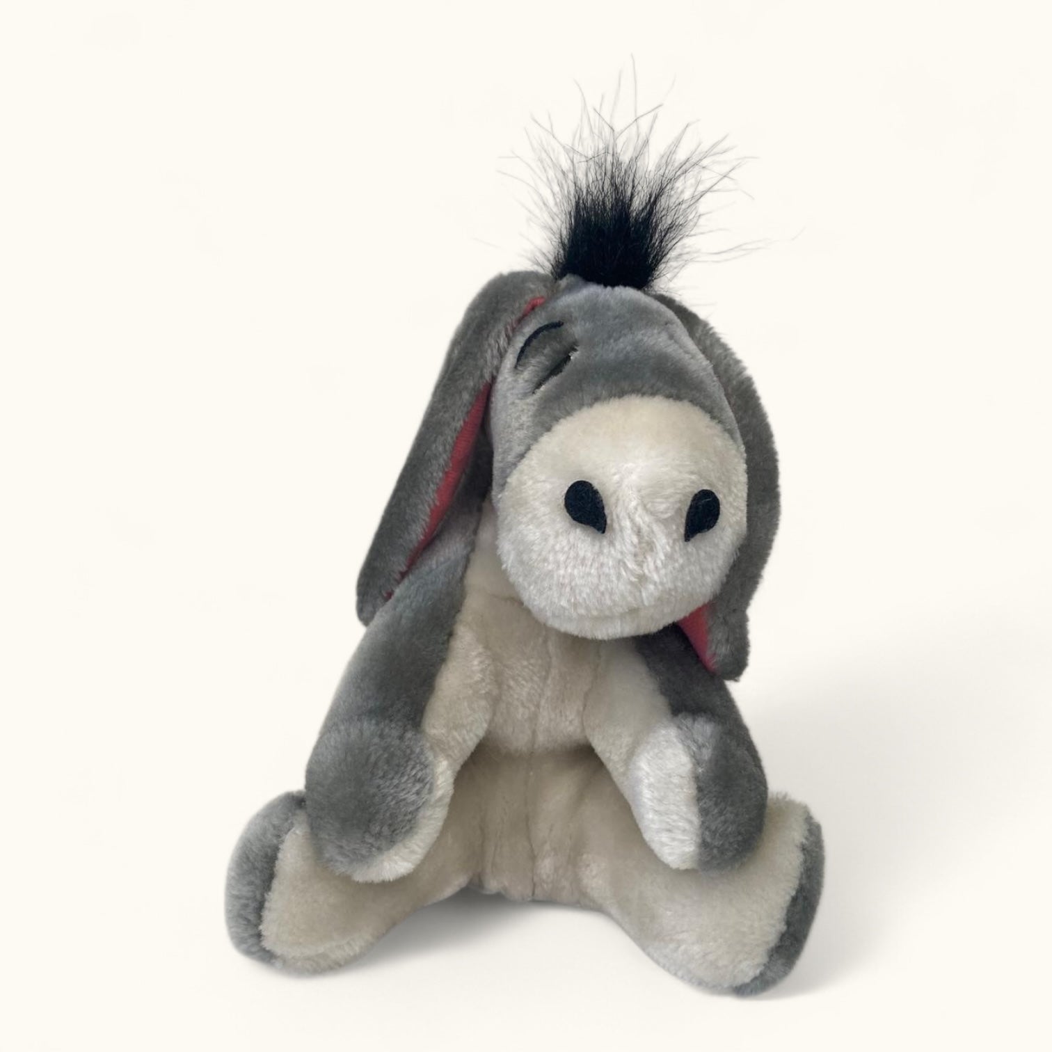 Plush donkey toy on a white background