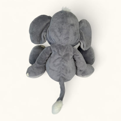 Gray plush elephant toy on a white background