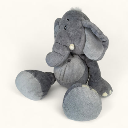 Gray plush elephant toy on a white background