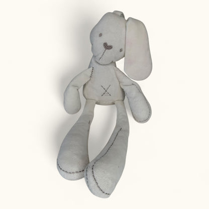 Gray stuffed bunny toy with a visible brand logo on a white background