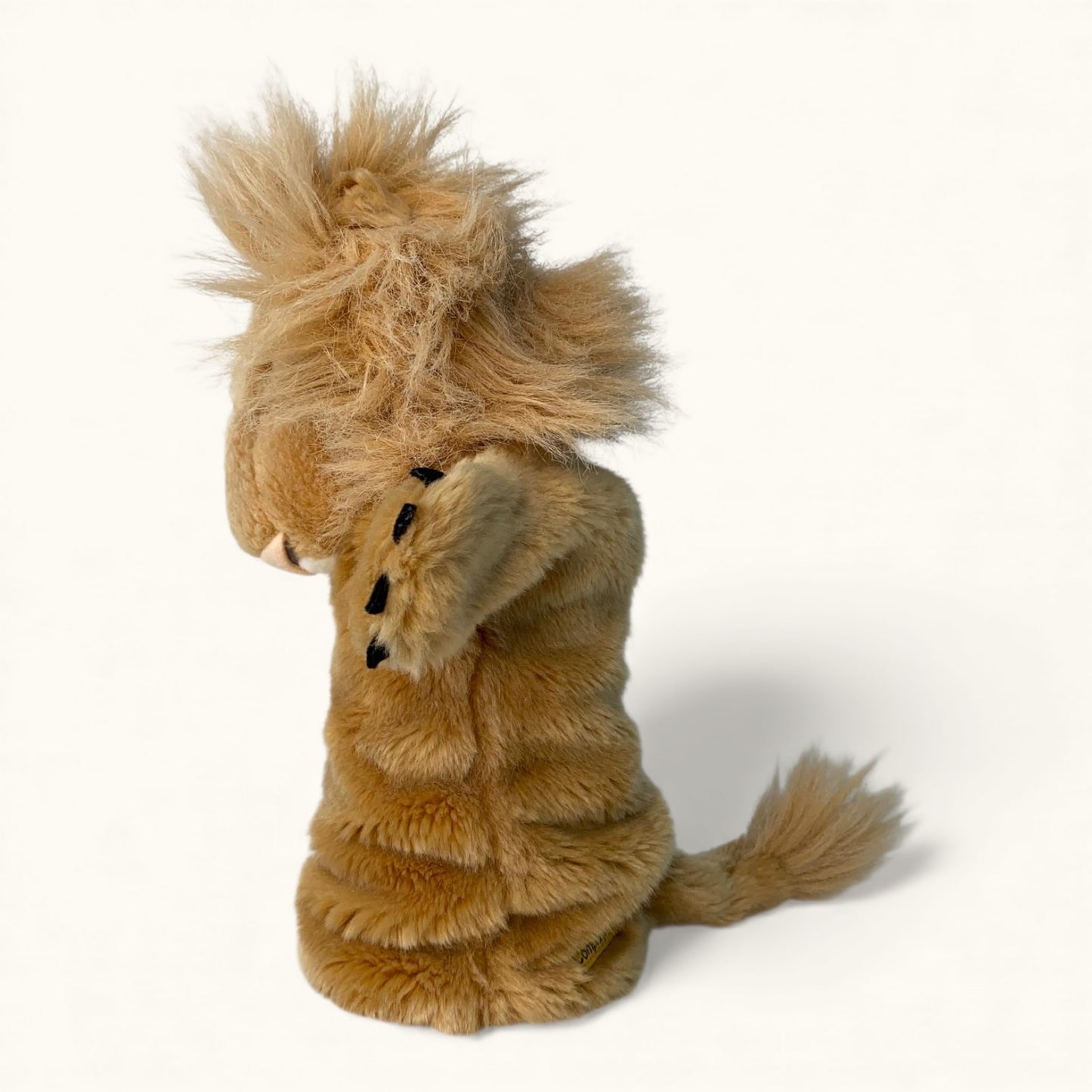 Plush lion toy on a white background