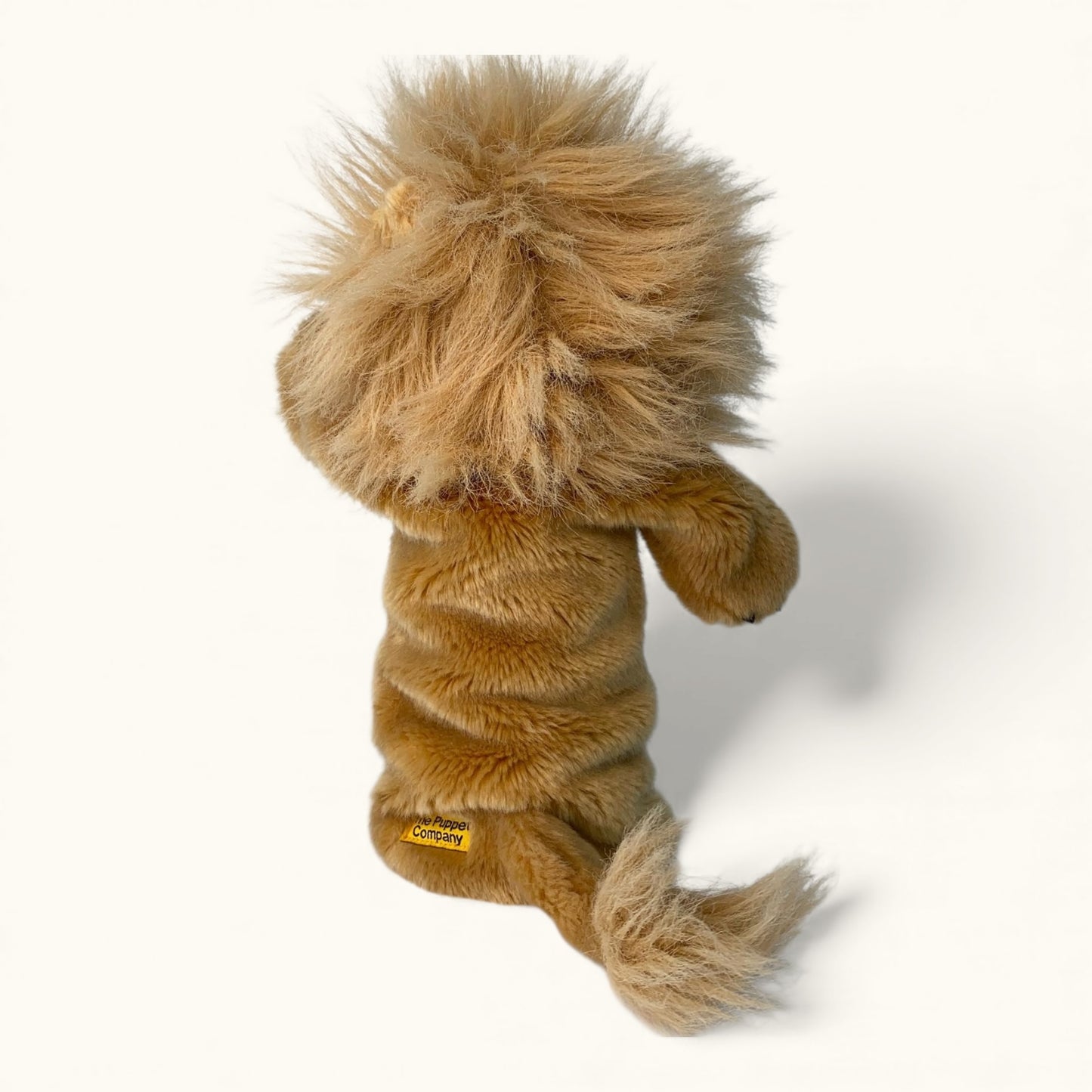Plush lion toy on a white background