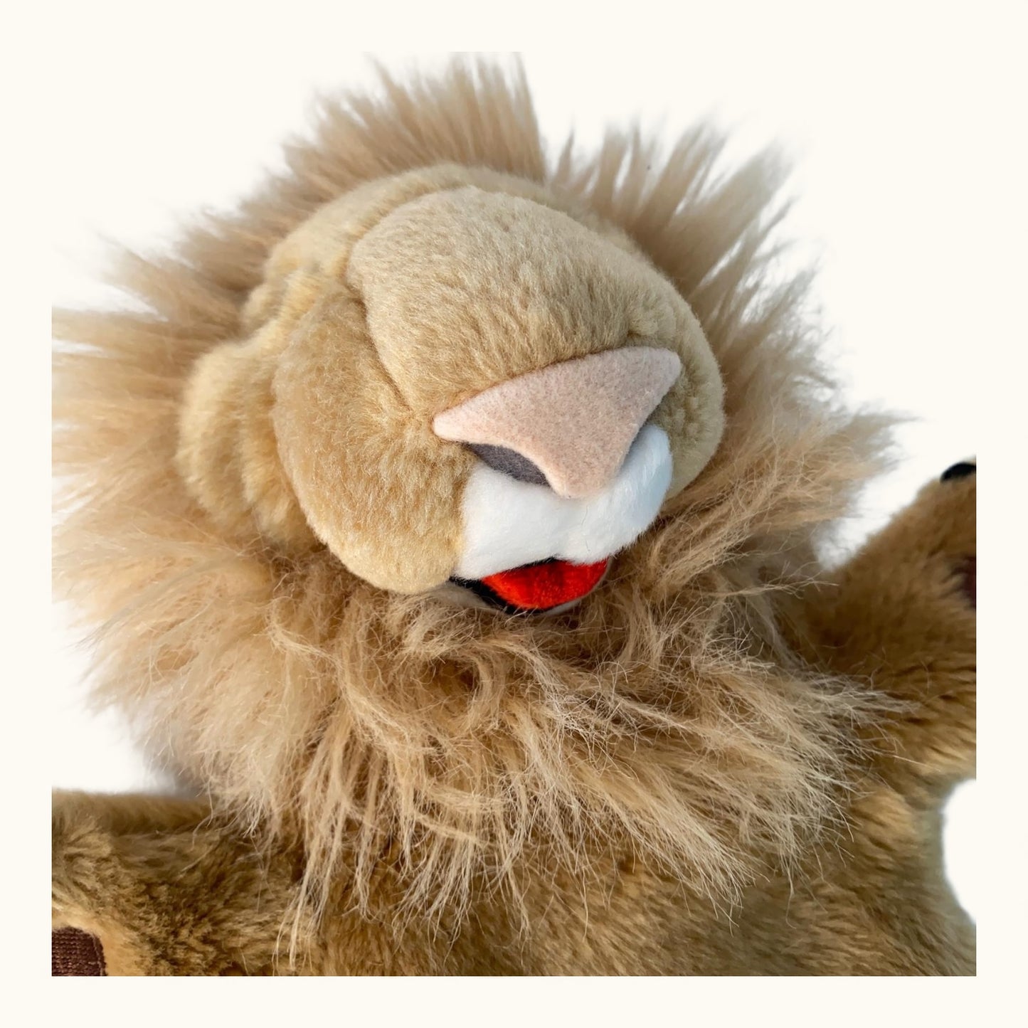 Close-up of a lion plush toy with a white background
