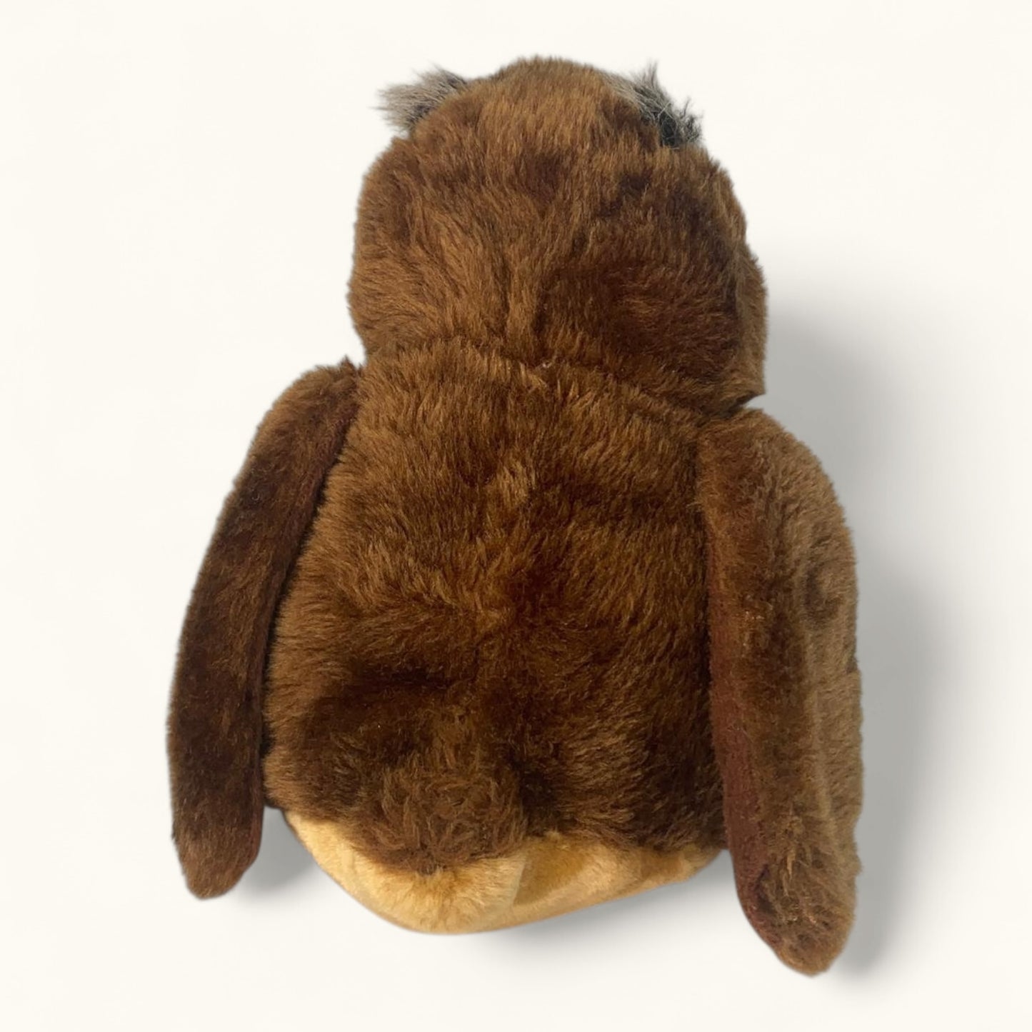 Brown plush owl toy on a white background