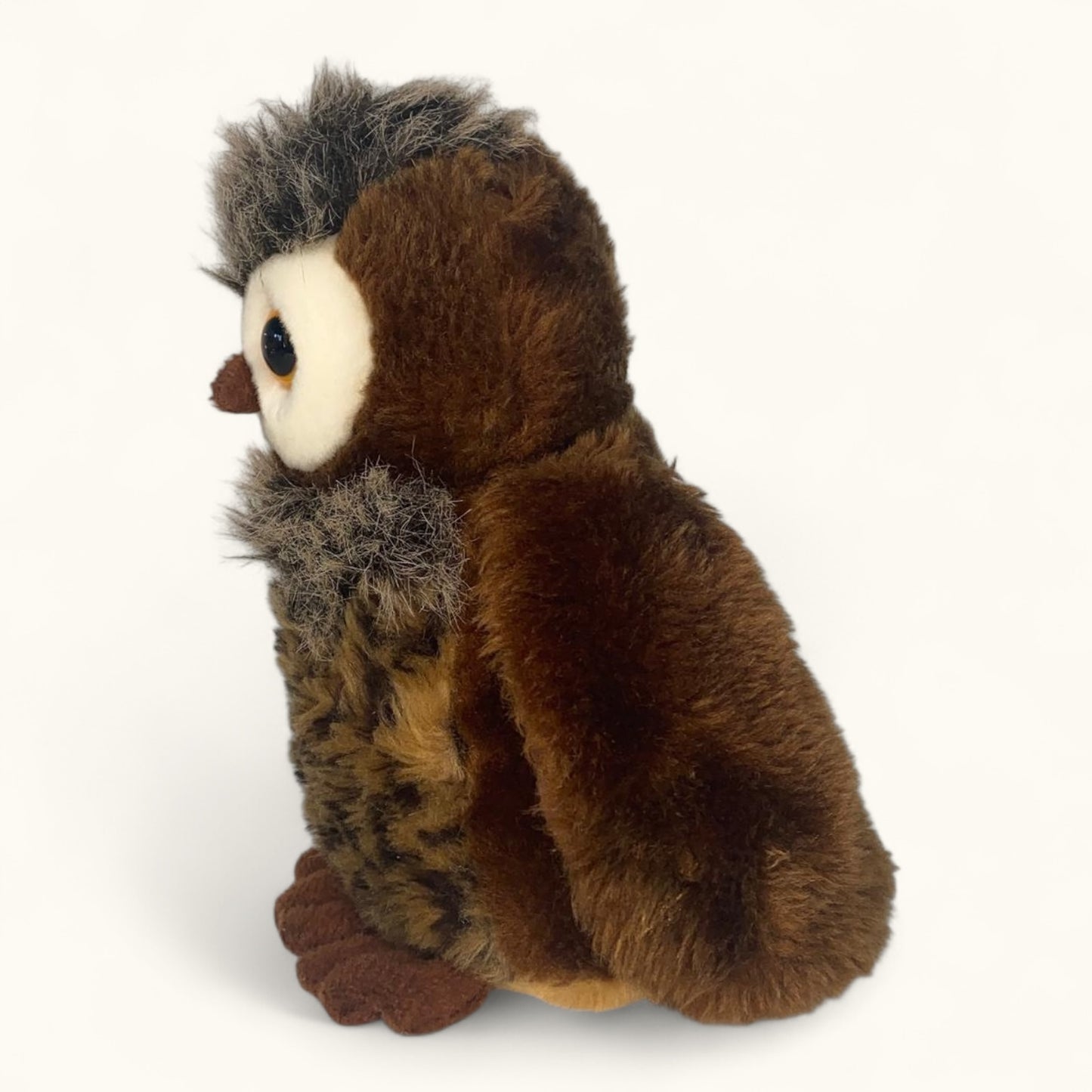 Plush owl toy on a white background