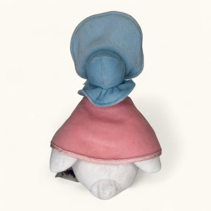 White teddy bear with a blue hood and pink garment on a white background