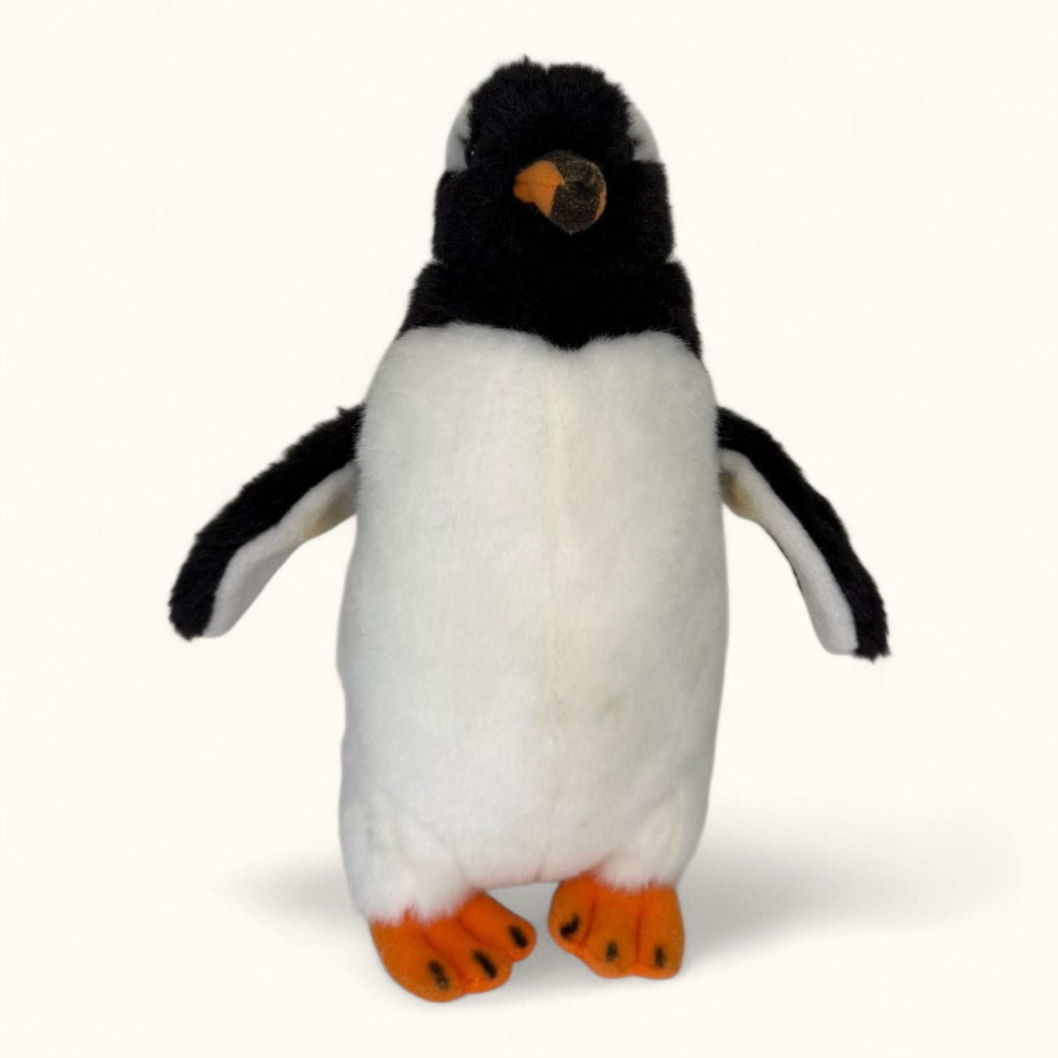 Plush penguin toy on a white background