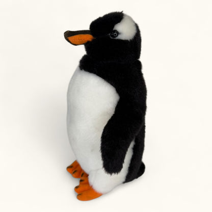 Plush penguin toy on a white background
