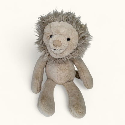 Plush lion toy on a white background