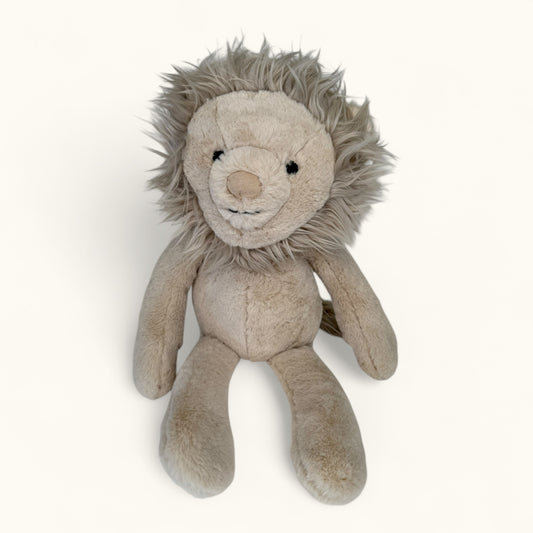 Plush lion toy on a white background