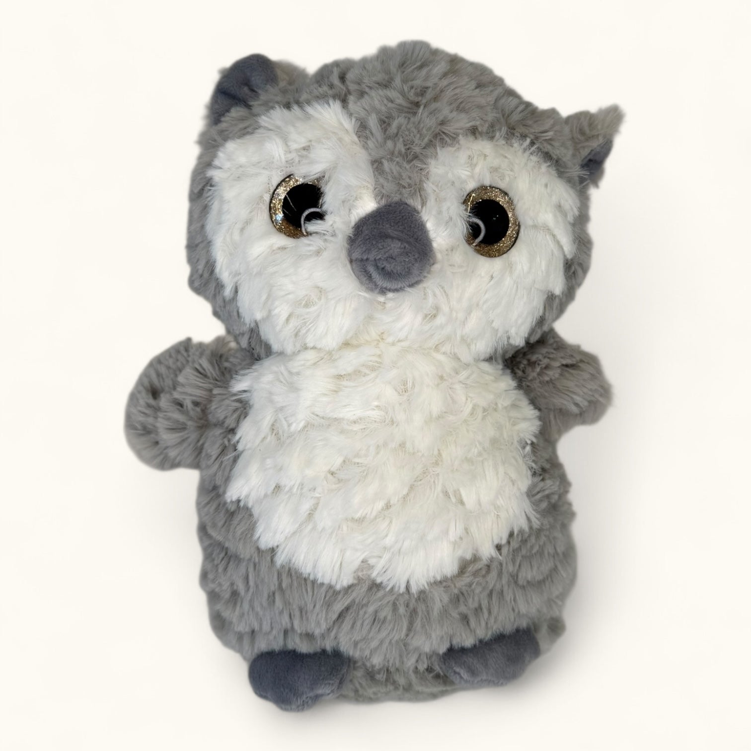 Plush toy resembling an owl on a white background
