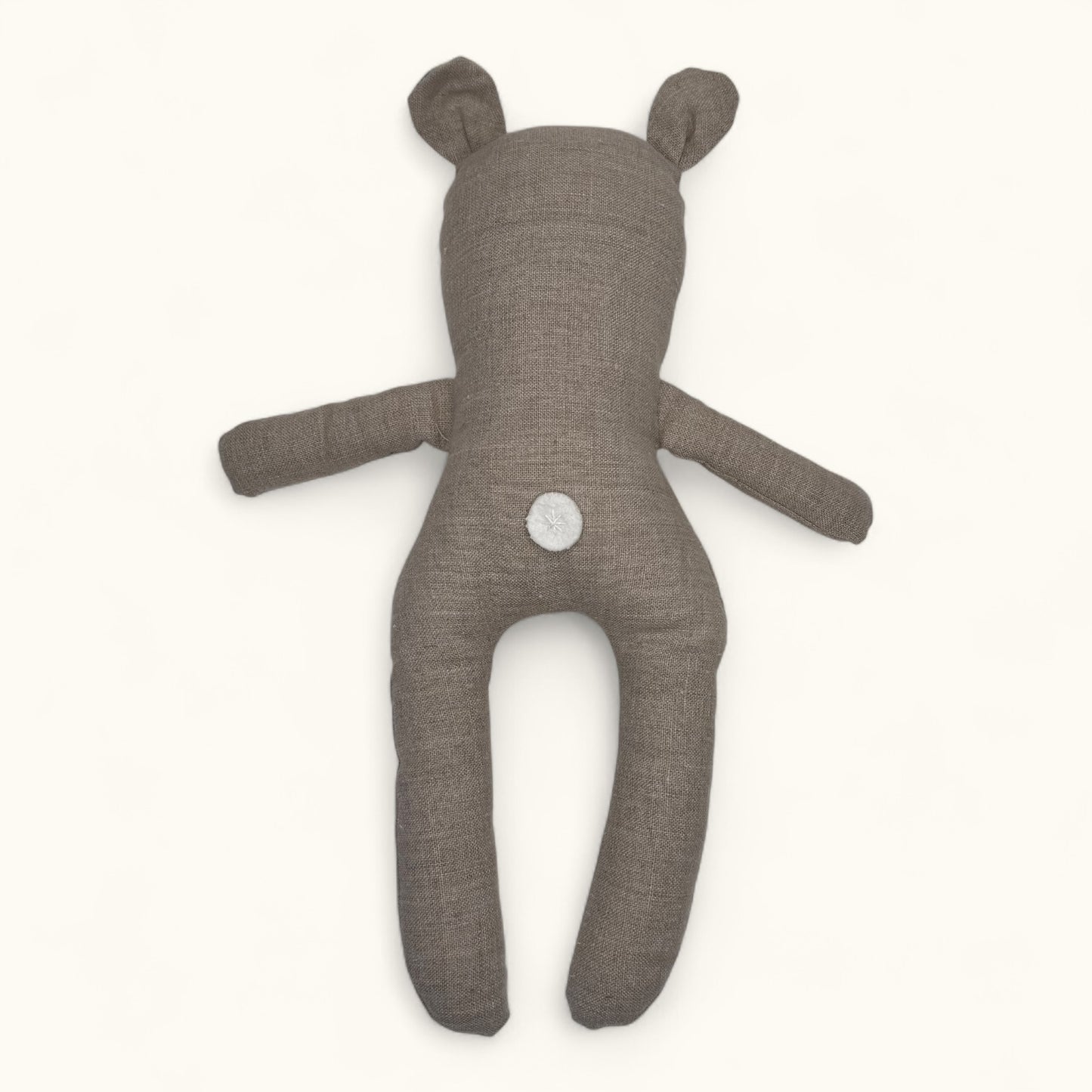 Brown teddy bear plush toy on a white background