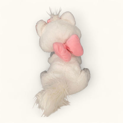 Plush toy with a pink bow on a white background