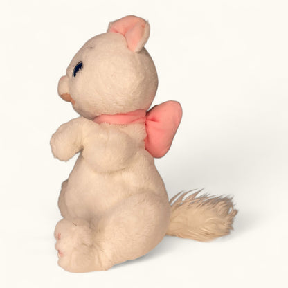 Plush toy with a pink bow on a white background
