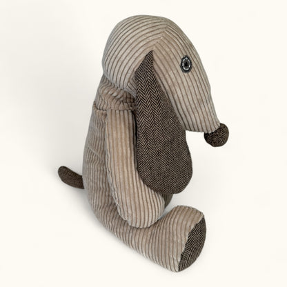 Stuffed animal toy with a striped pattern on a white background