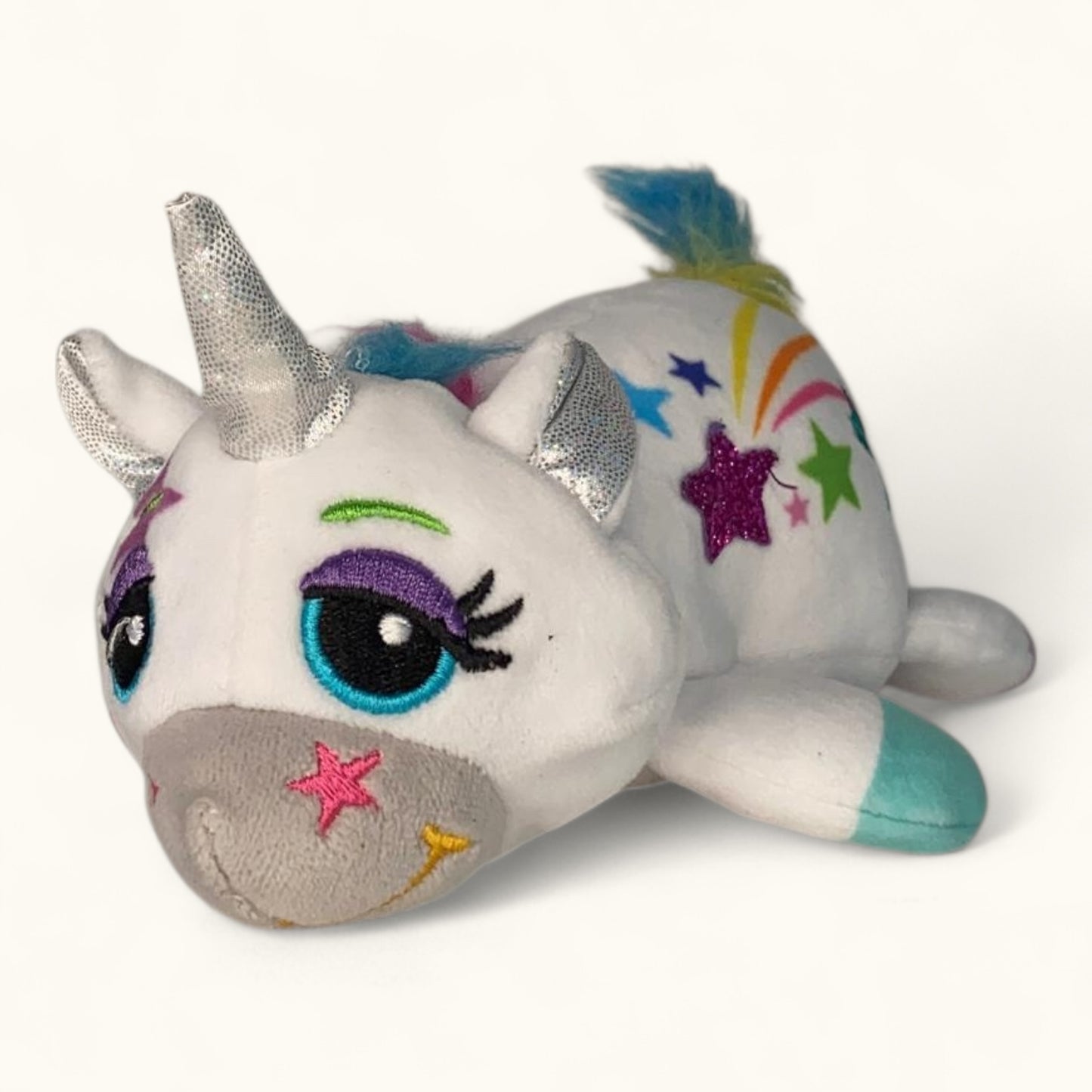 Plush unicorn toy with colorful stars on a white background