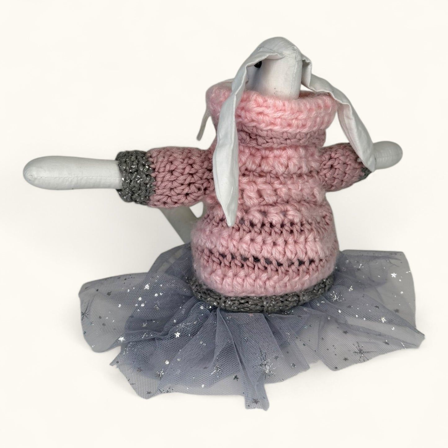 Bunny with Knitted pink dress with a gray tutu on a white background