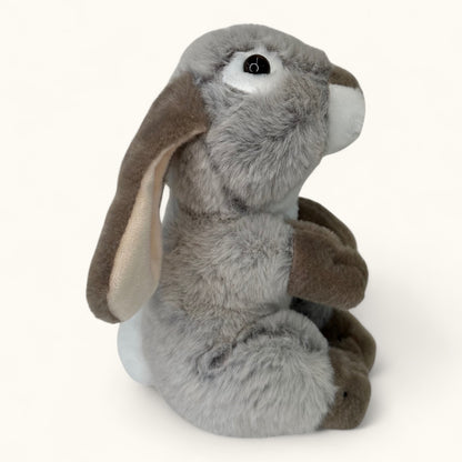 Plush toy rabbit with gray body and brown ears on a white background