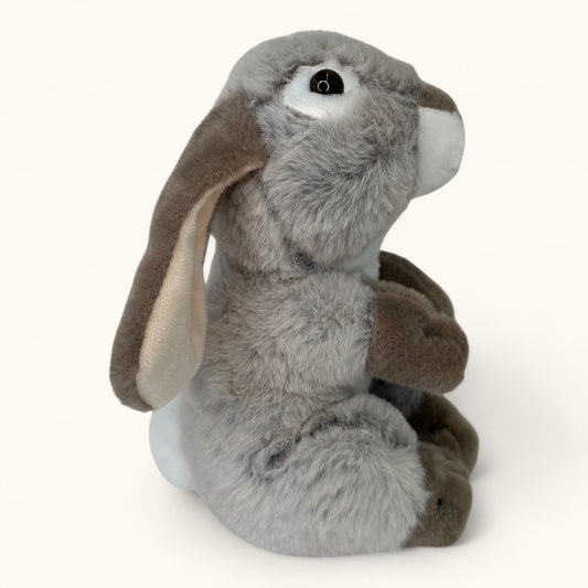 Plush toy rabbit with gray body and brown ears on a white background