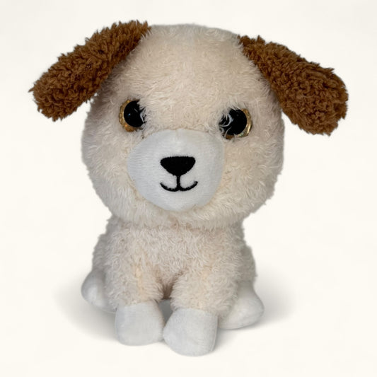Plush toy dog with brown ears and white face on a white background