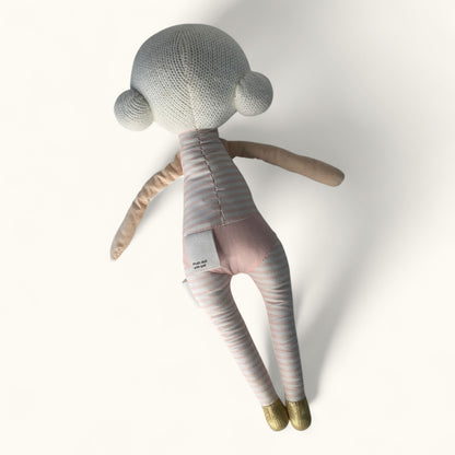 Stuffed doll toy with a plain background