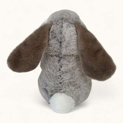 Plush toy rabbit with gray body and brown ears on a white background