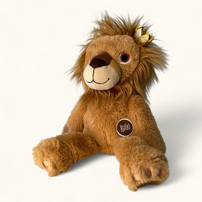 Plush lion toy with a crown on a white background