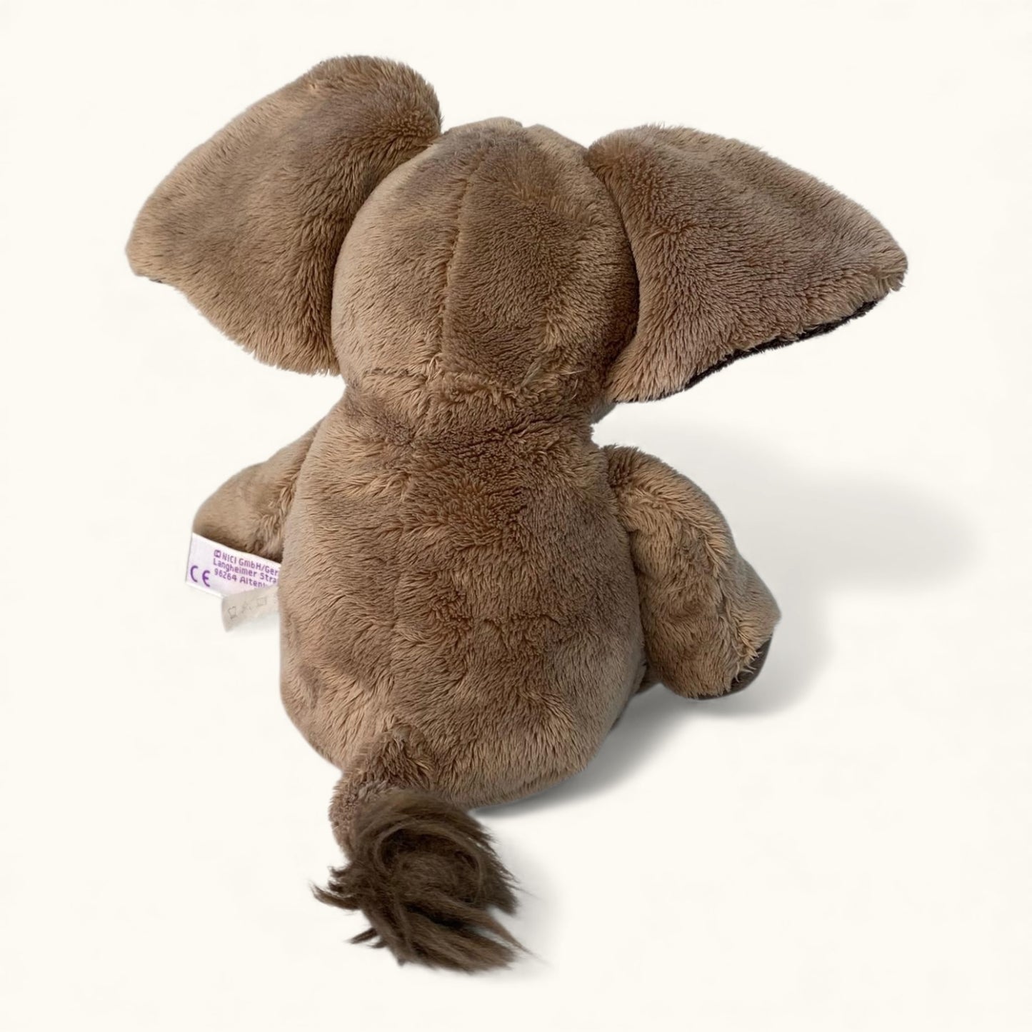 Plush elephant toy on a white background