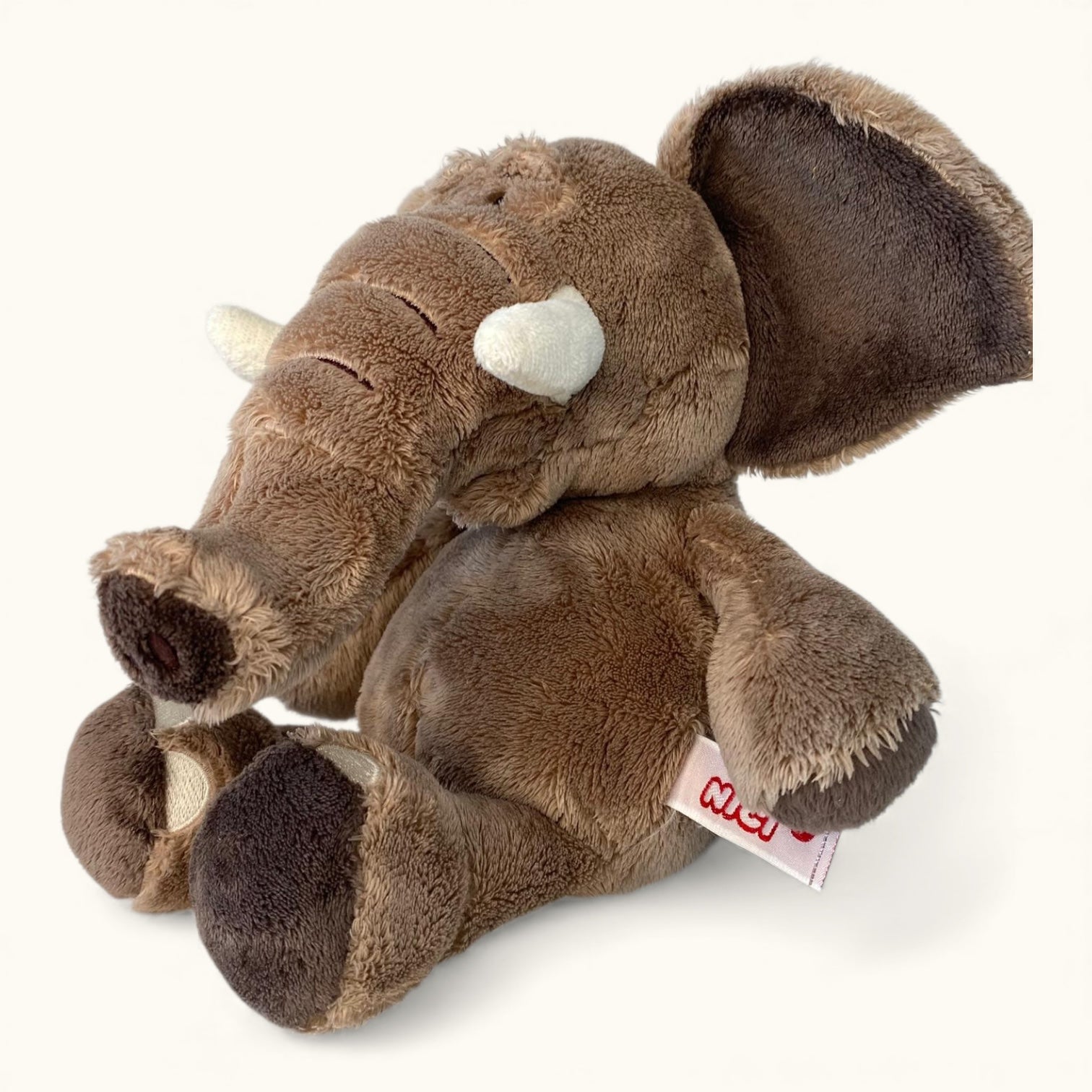 Plush elephant toy on a white background