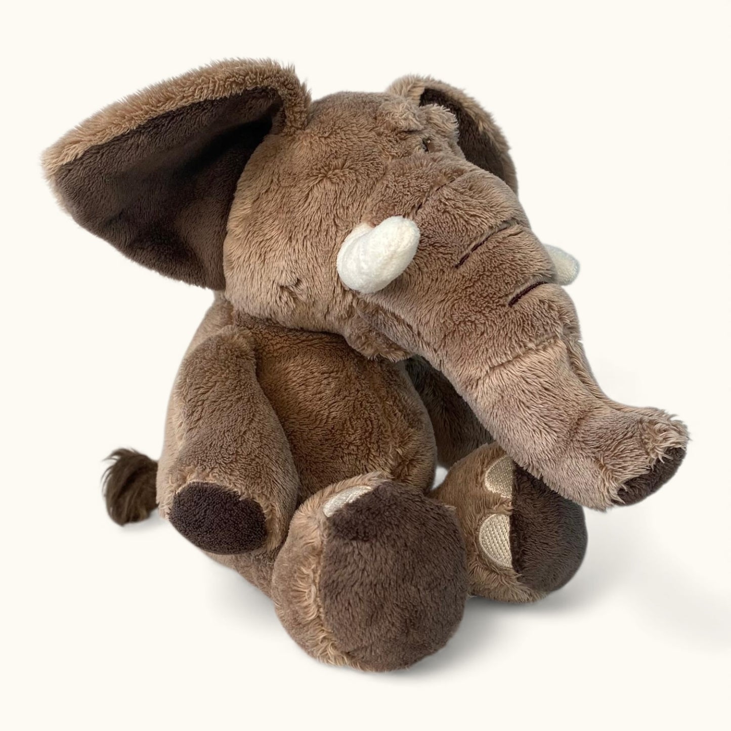 Plush elephant toy on a white background