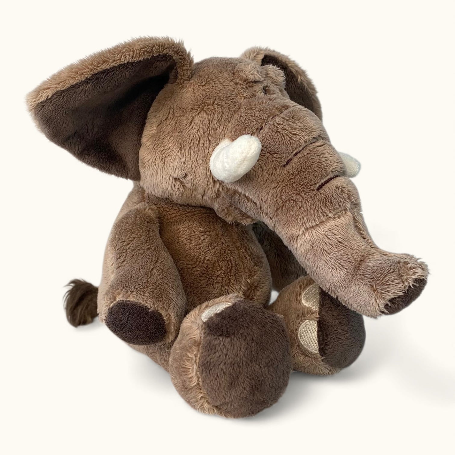 Plush elephant toy on a white background