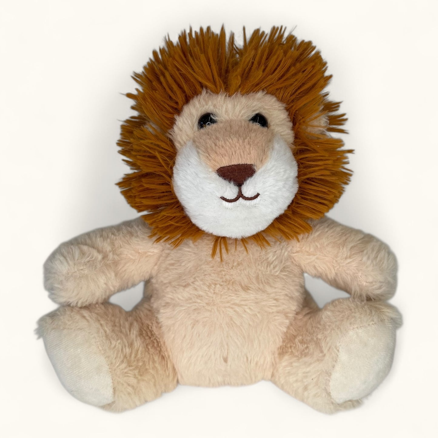 Plush lion toy with a brown mane on a white background