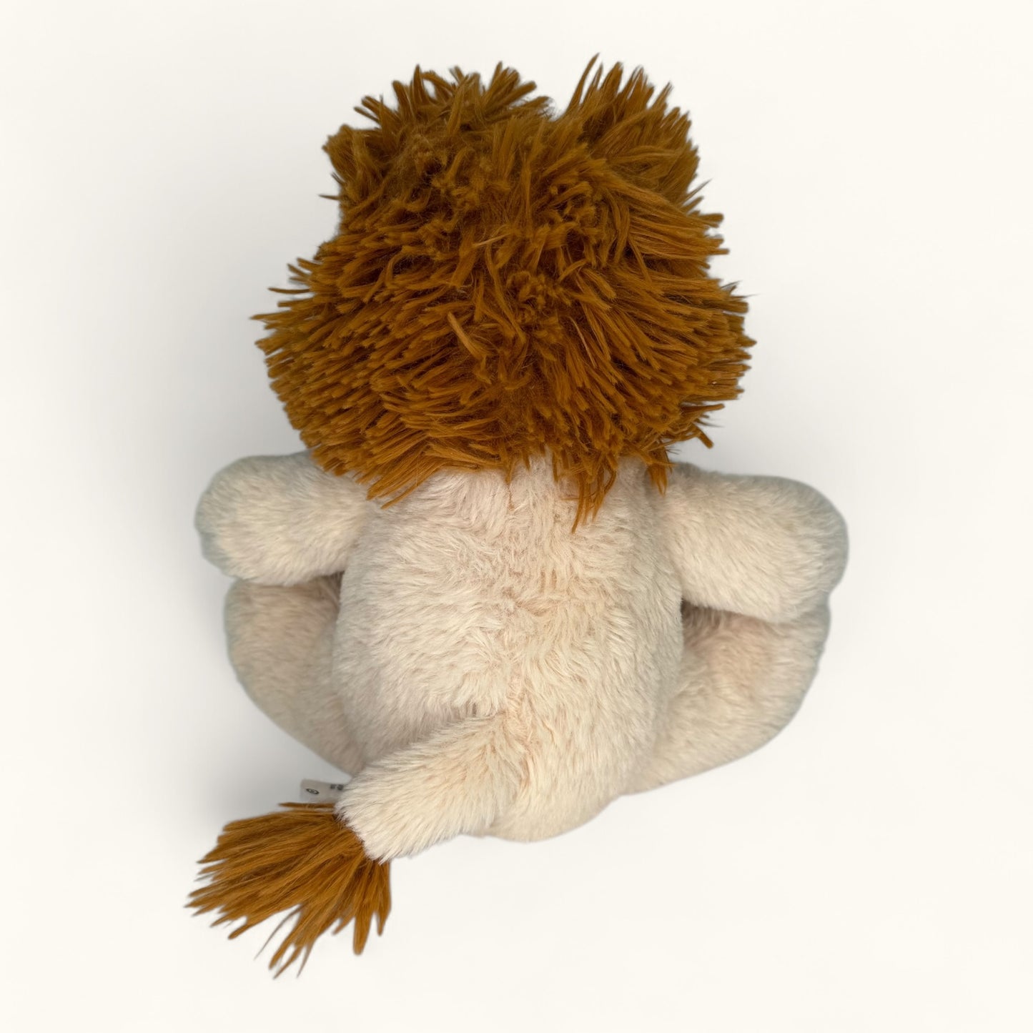 Plush lion toy with brown mane on a white background
