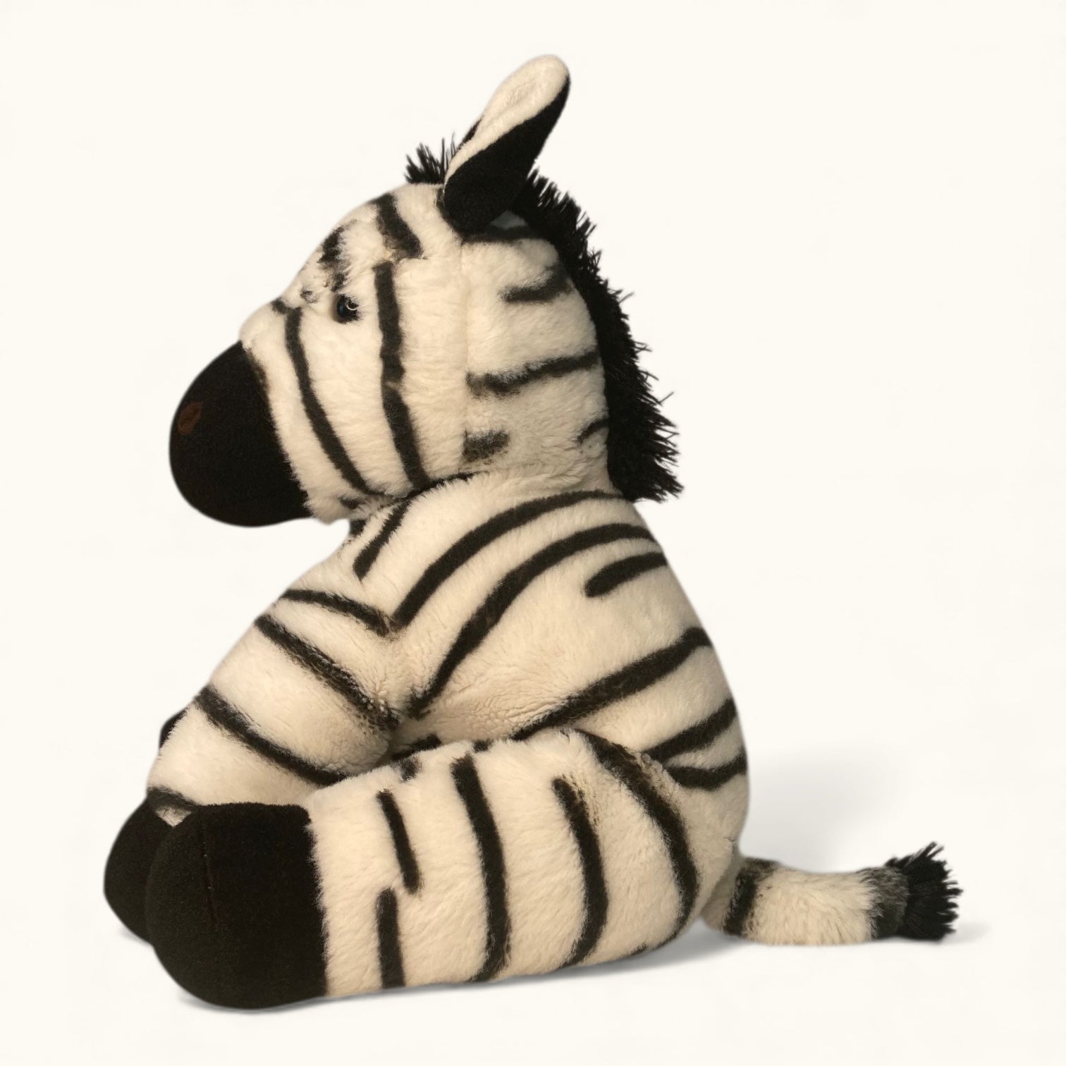 Plush zebra toy on a white background