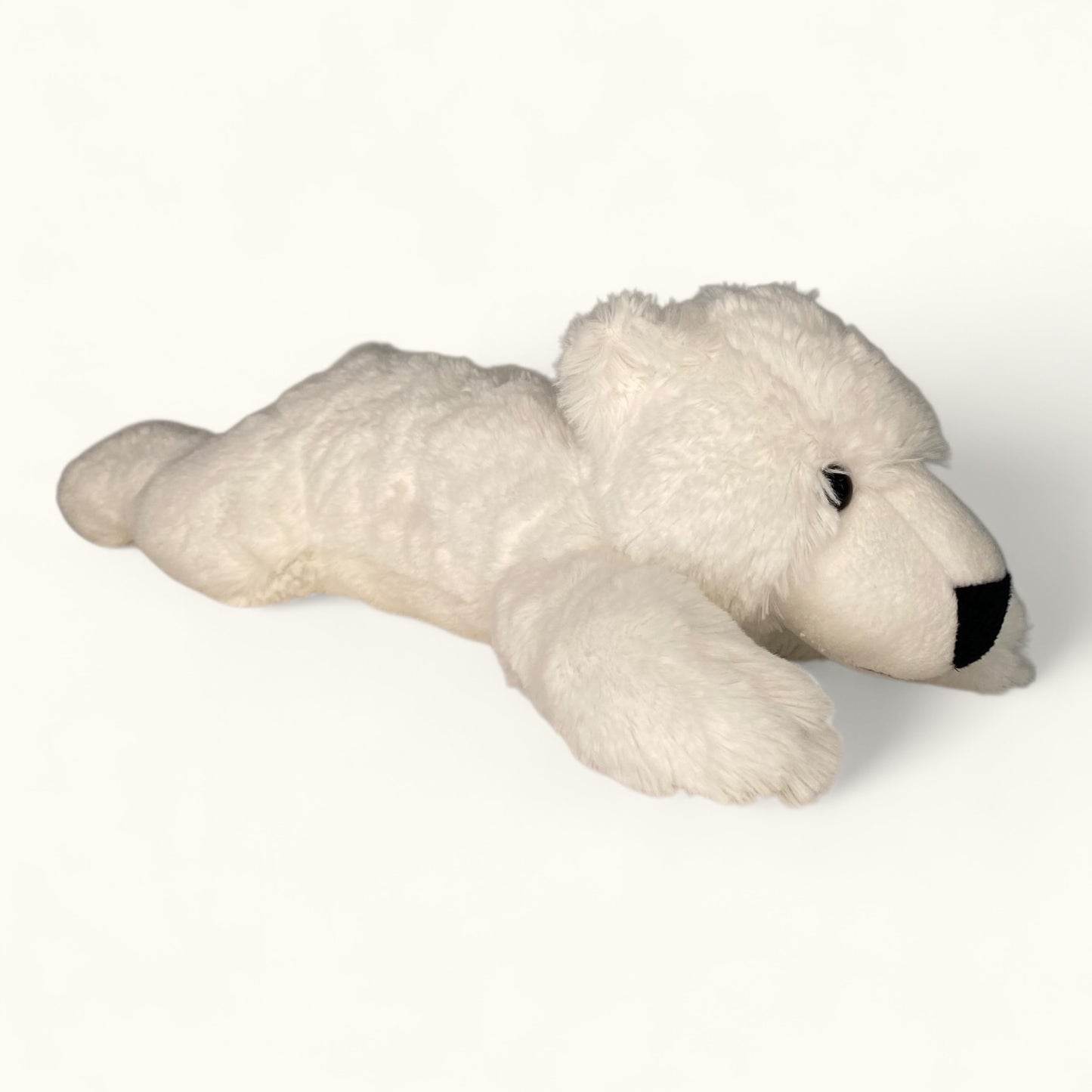 Plush polar bear toy on a white background