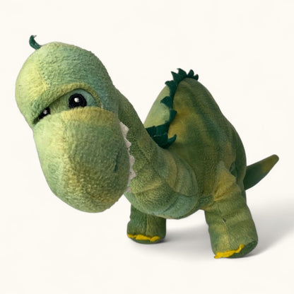Green dinosaur plush toy on a white background