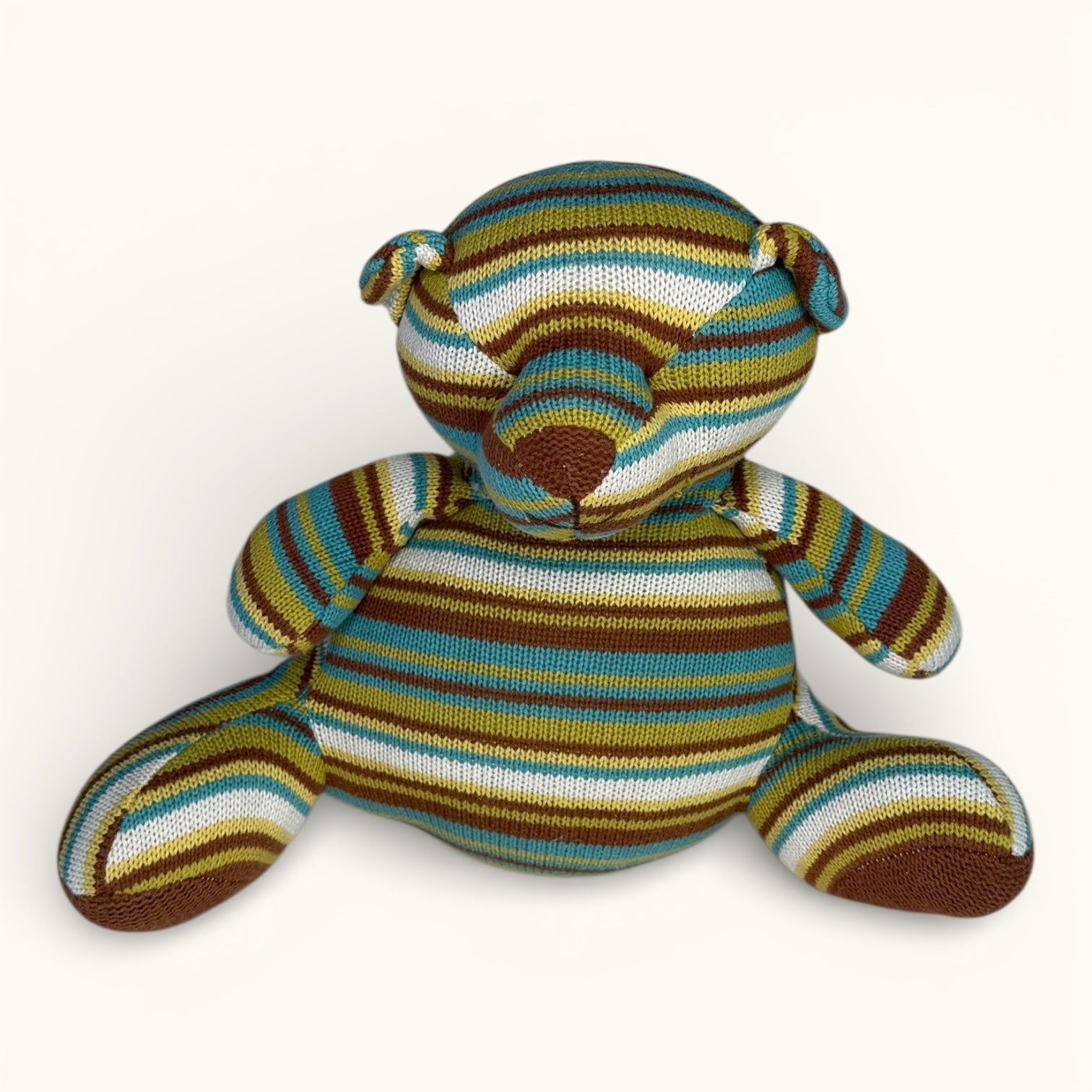 Striped teddy bear on a white background