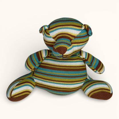 Striped teddy bear on a white background
