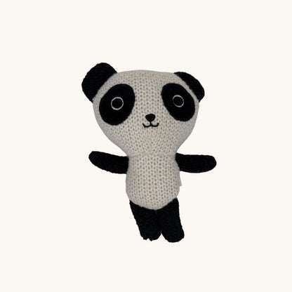 Knitted panda toy on a white background