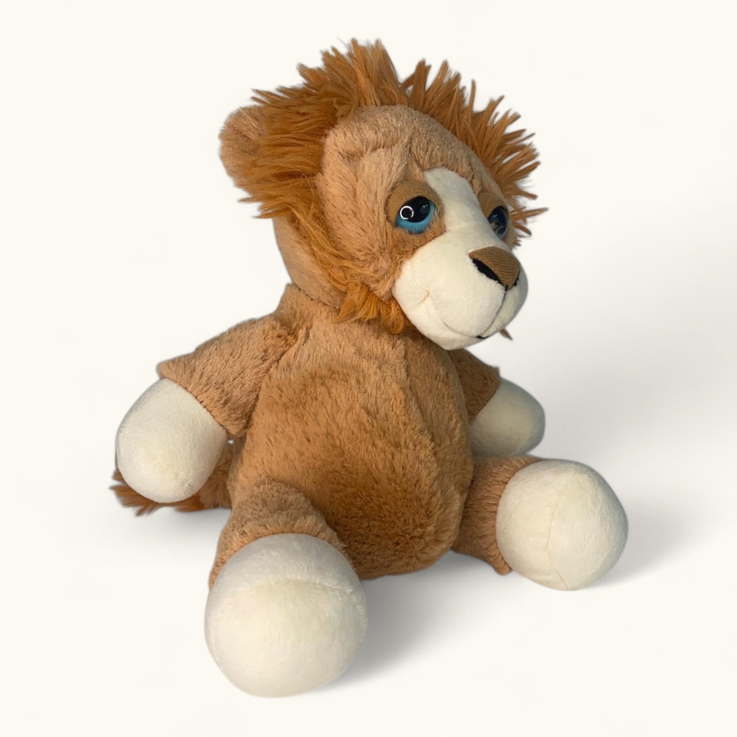 Plush lion toy on a white background