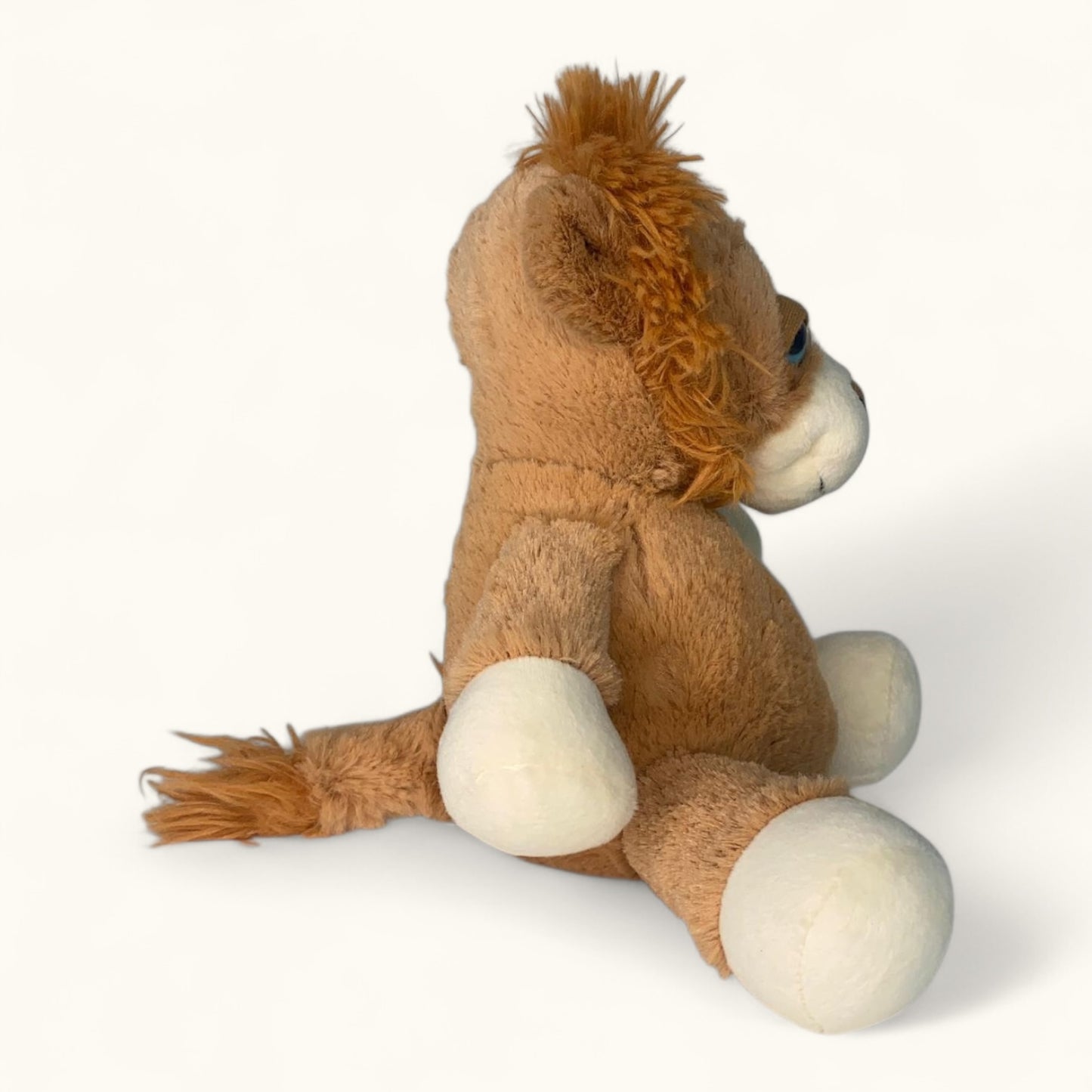 Plush lion toy on a white background