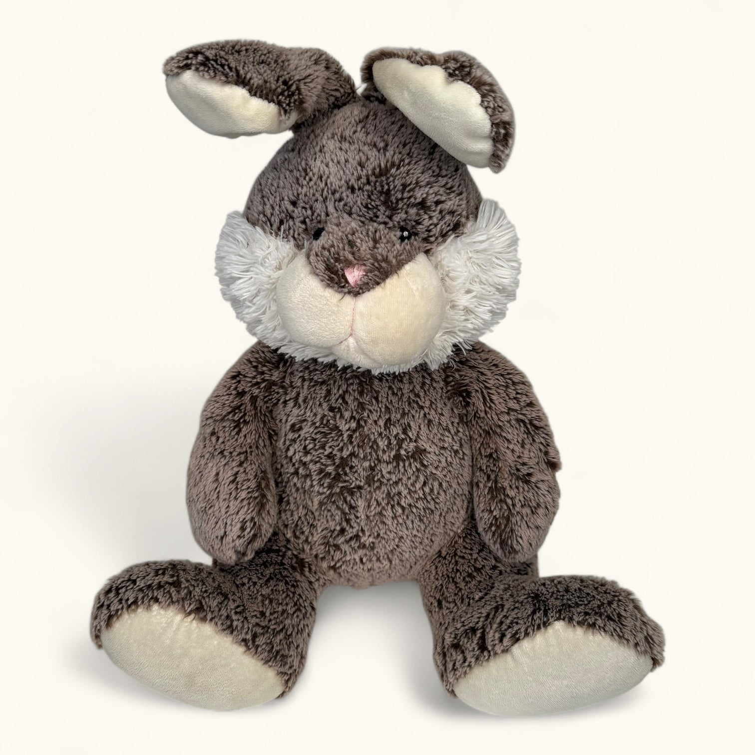 Plush toy rabbit with brown fur and white accents on a white background